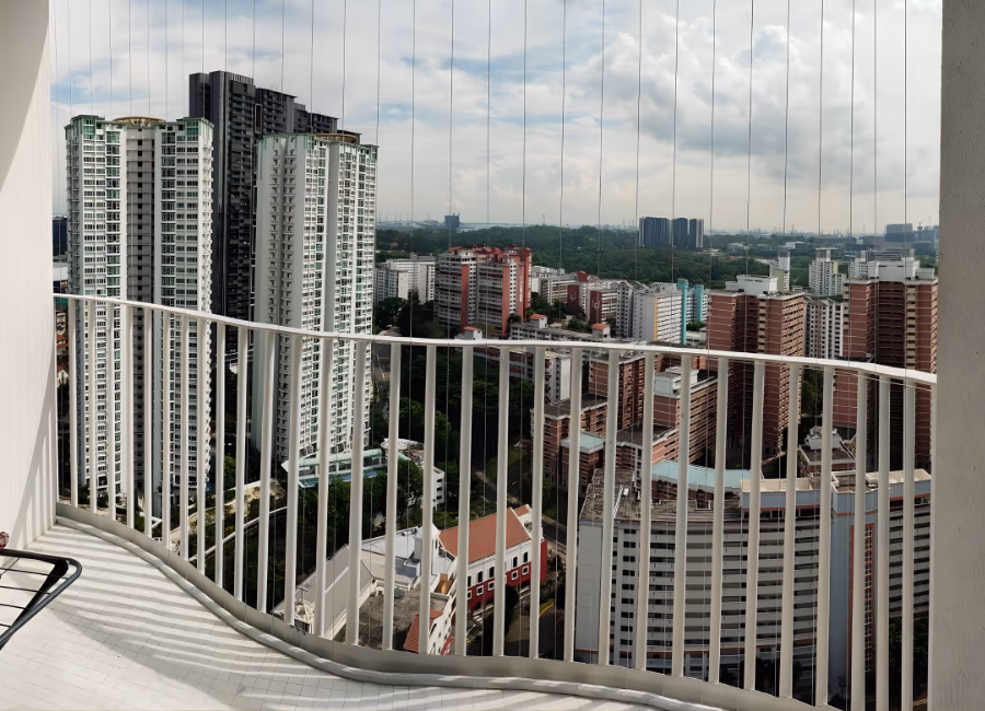 Invisible grille wires along a high-rise Singapore balcony railing