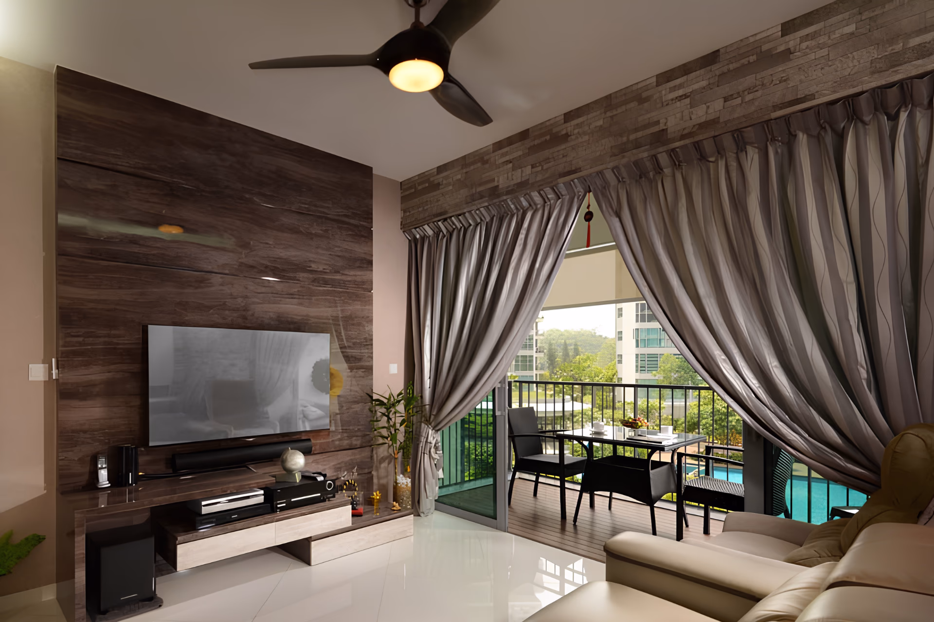 Taupe night curtains and sheers framing a balcony door in a Singapore condominium living room