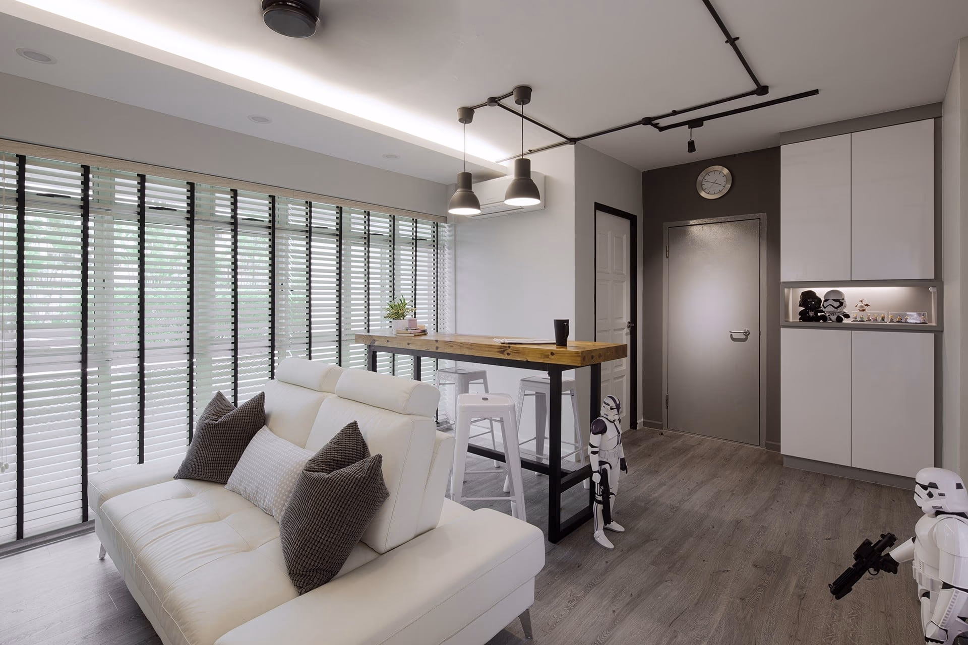 White wood Venetian blinds across the living and dining windows of a Singapore HDB flat