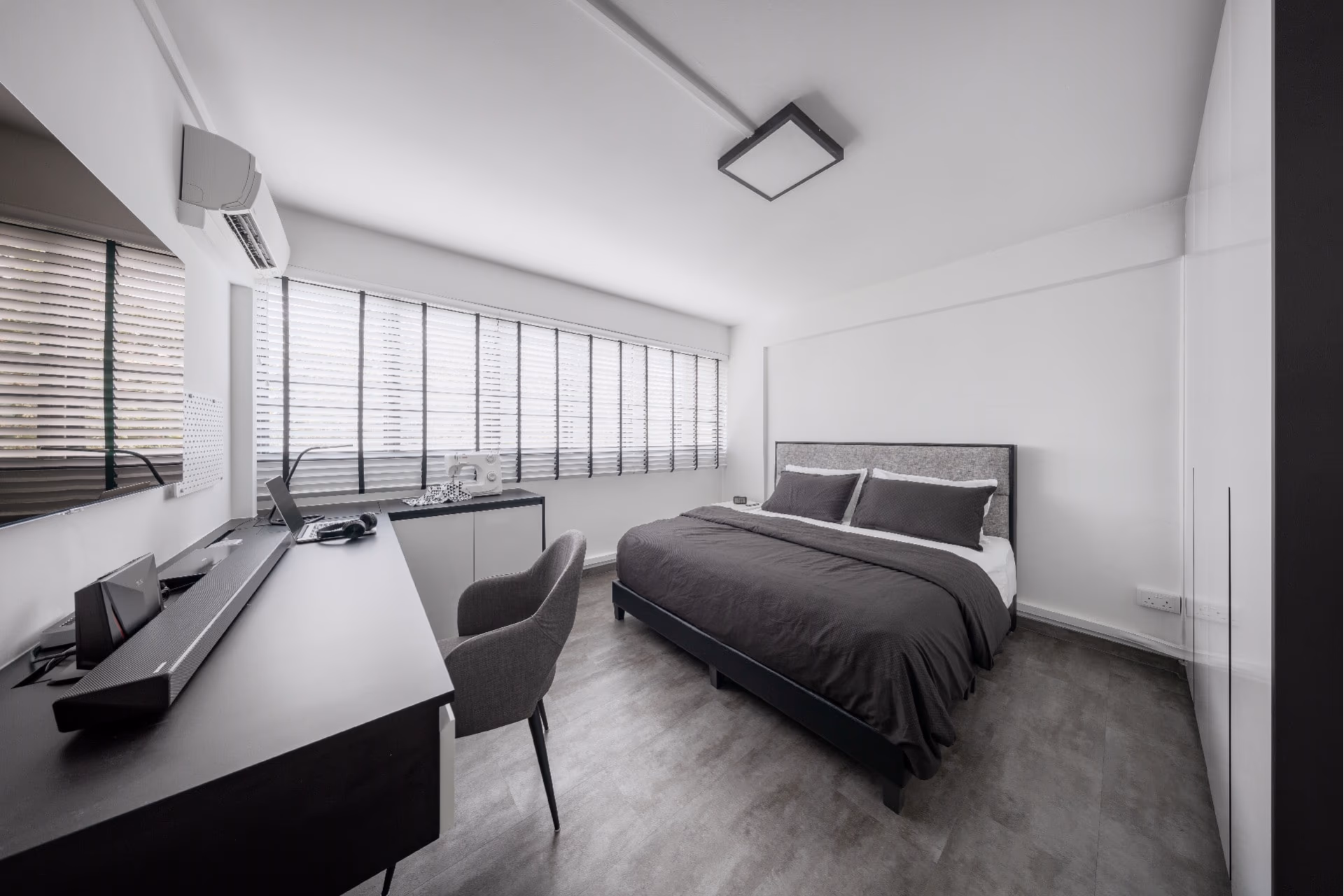 Floor-to-ceiling white Venetian blinds in a Singapore HDB living room